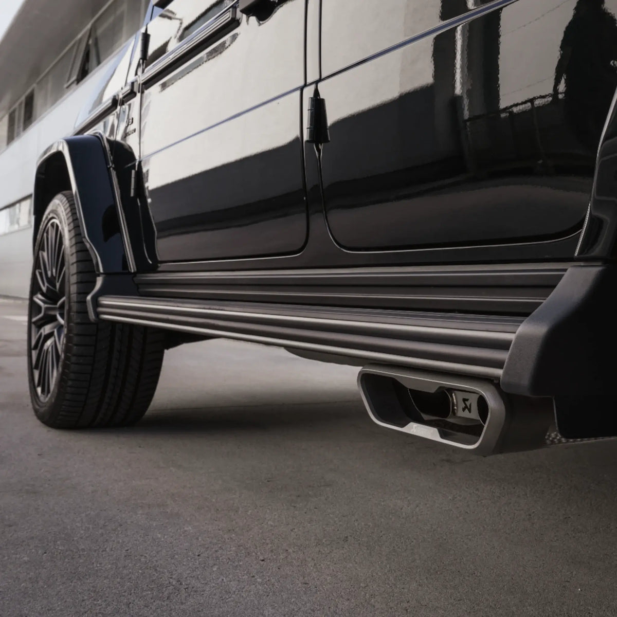 Closer view of Akrapovic Evolution Line Titanium Performance Exhaust installed on Mercedes-AMG G 63 W465, highlighting the dual-exit tailpipe design.