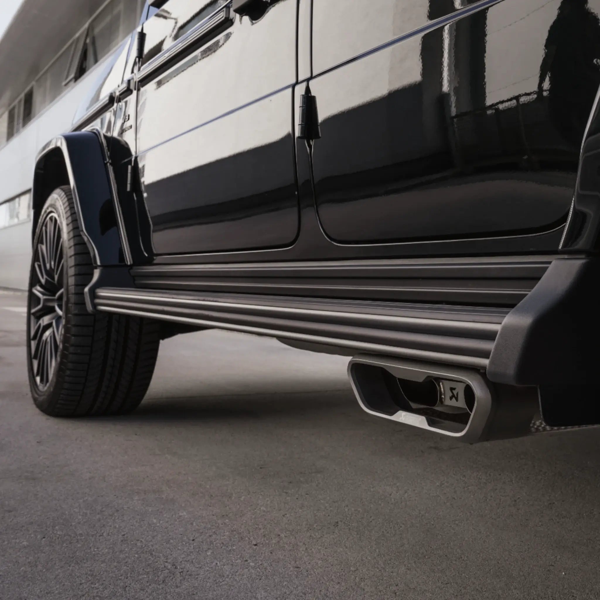 Closer view of Akrapovic Evolution Line Titanium Performance Exhaust installed on Mercedes-AMG G 63 W465, highlighting the dual-exit tailpipe design.