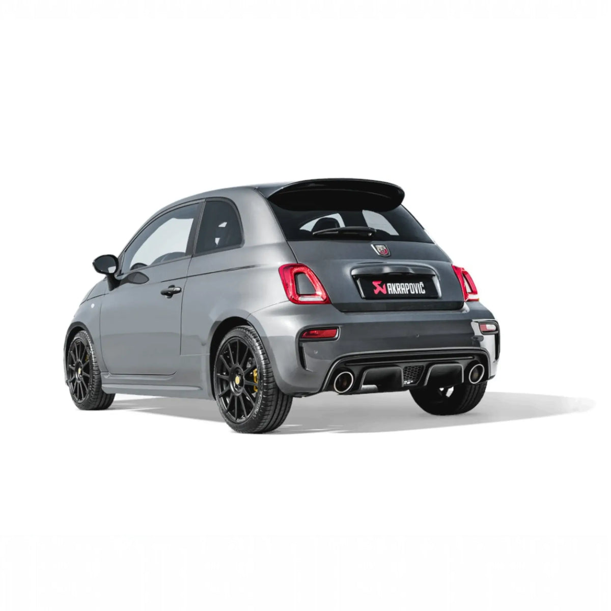 Rear angle of an Abarth 595 equipped with the Akrapovič Slip-On Line, showcasing seamless fitment and sporty aesthetics.