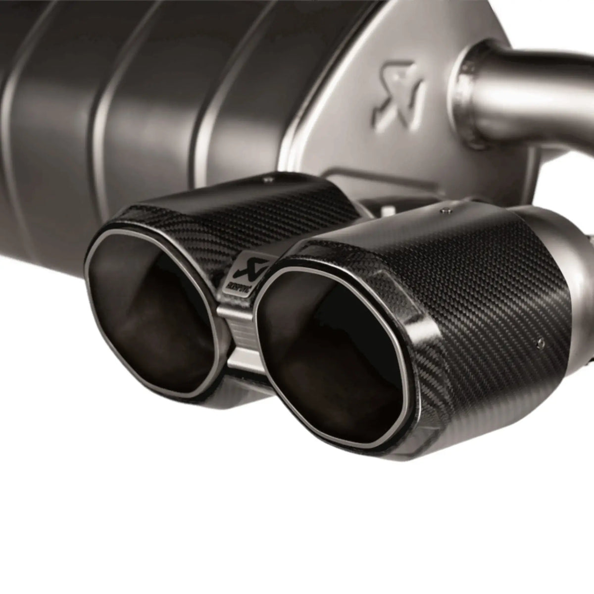 Close-up of Akrapovic Slip-On Line Titanium Performance Exhaust for BMW M2 G87, highlighting precision-crafted components and premium finish.