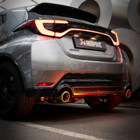 
Rear angle of Toyota GR Yaris (Gen 2) equipped with the Akrapovič Slip-On Race Line (Titanium), showcasing seamless integration and performance-focused design.