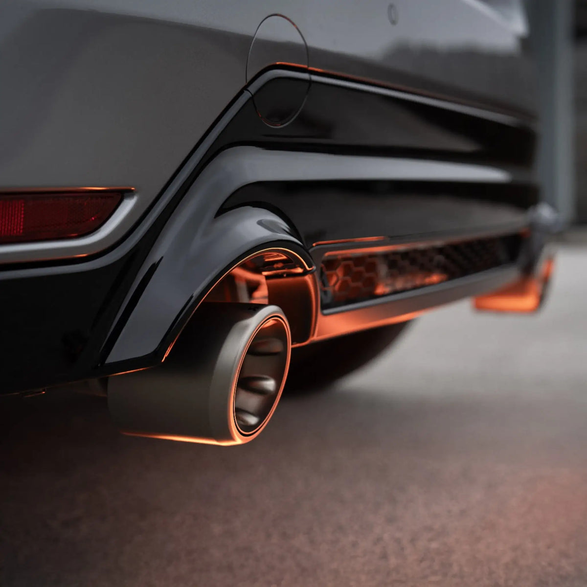 Close-up of the titanium tailpipe on the Toyota GR Yaris (Gen 2) with the Akrapovič Slip-On Race Line (Titanium), highlighting precision craftsmanship and premium materials.